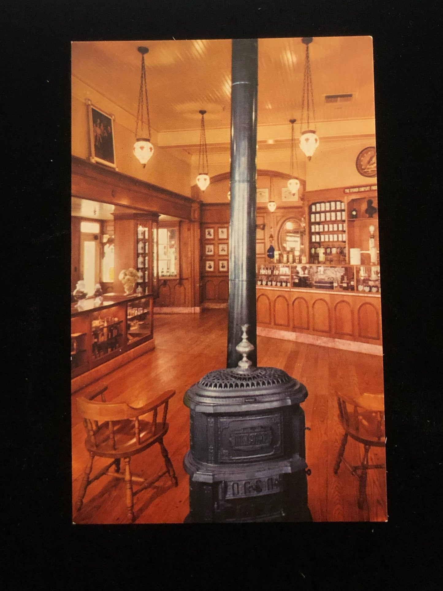 Upjohn's Old-Fashioned Pharmacy stove in Disneyland Vintage Postcard