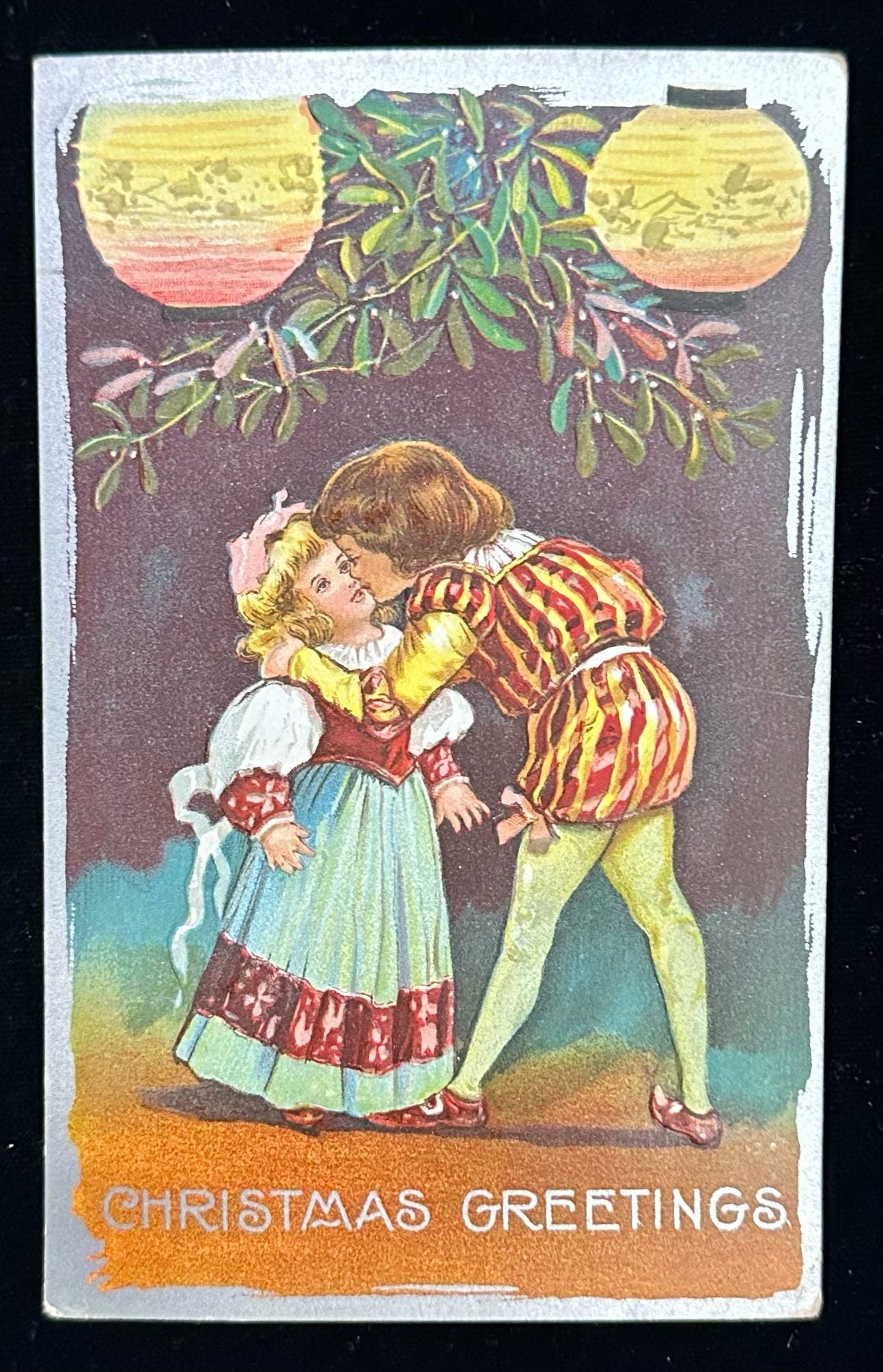 Christmas Greetings- Little English Lord Kissing Young Maiden Vintage Postcard