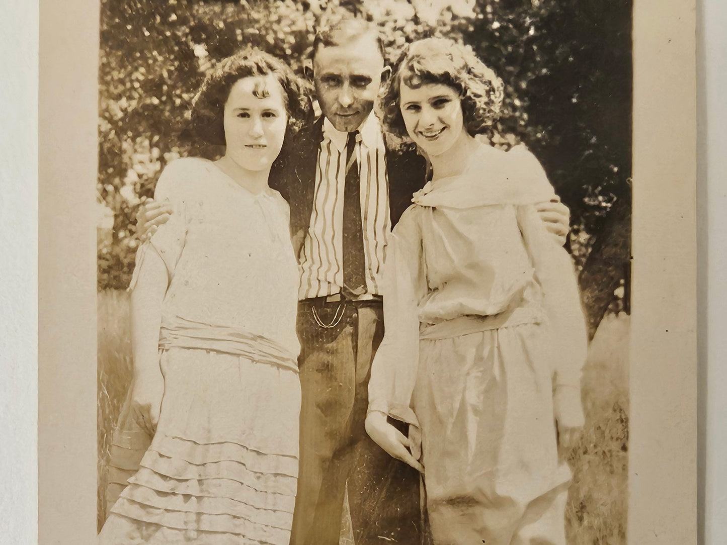 Photo of a Man and Two girls- Smiling about 1905 - Siblings in Spring - Father and Daughters Sepia Tone Photograph