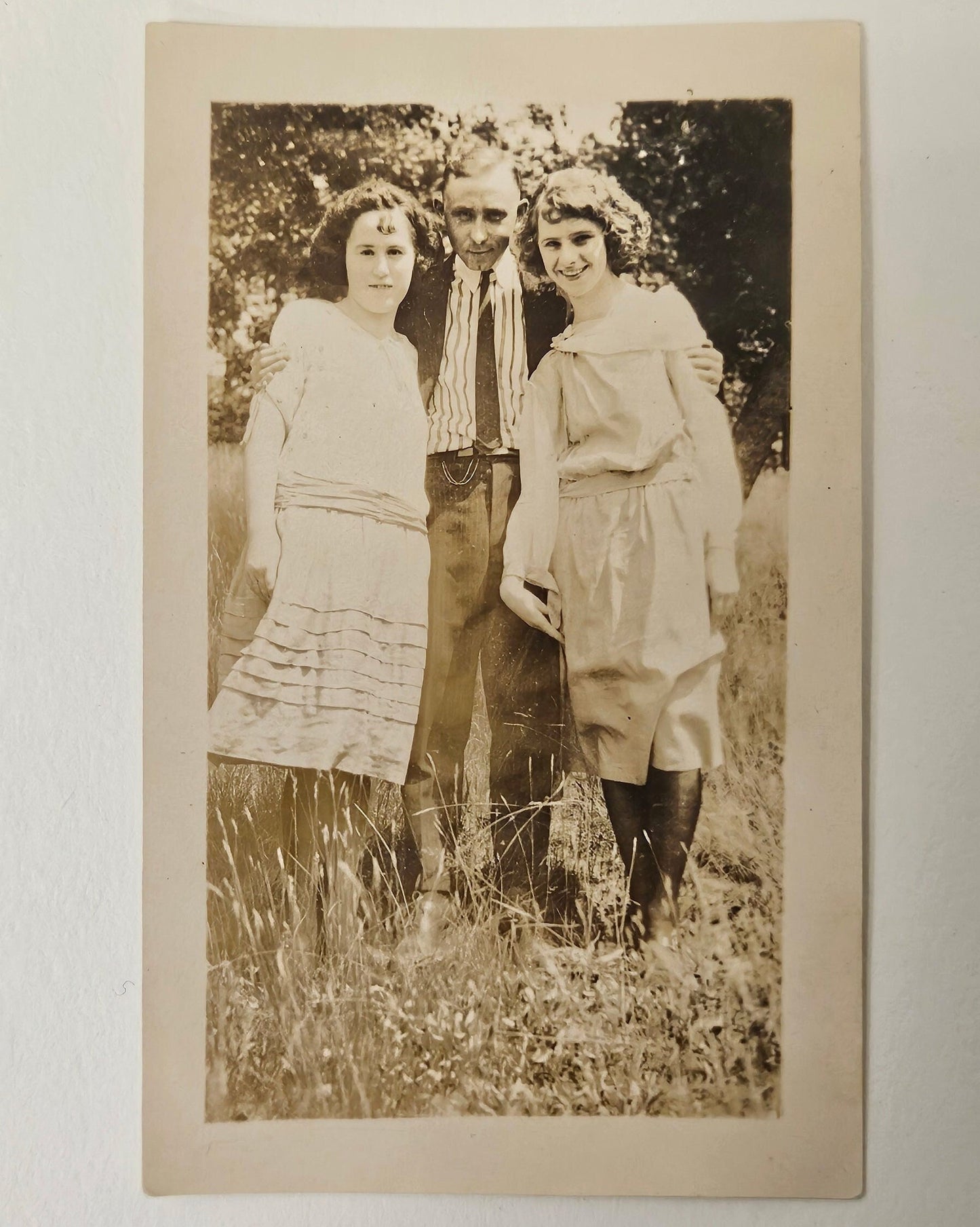 Photo of a Man and Two girls- Smiling about 1905 - Siblings in Spring - Father and Daughters Sepia Tone Photograph