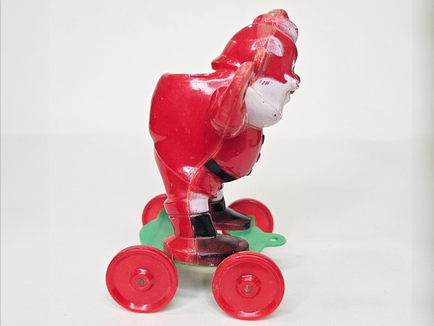 1950's Rosbro - Santa On Wheels Pull Toy and Candy Container - Hard Plastic Santa Candy Container - Missing Christmas stocking on Rt Hand