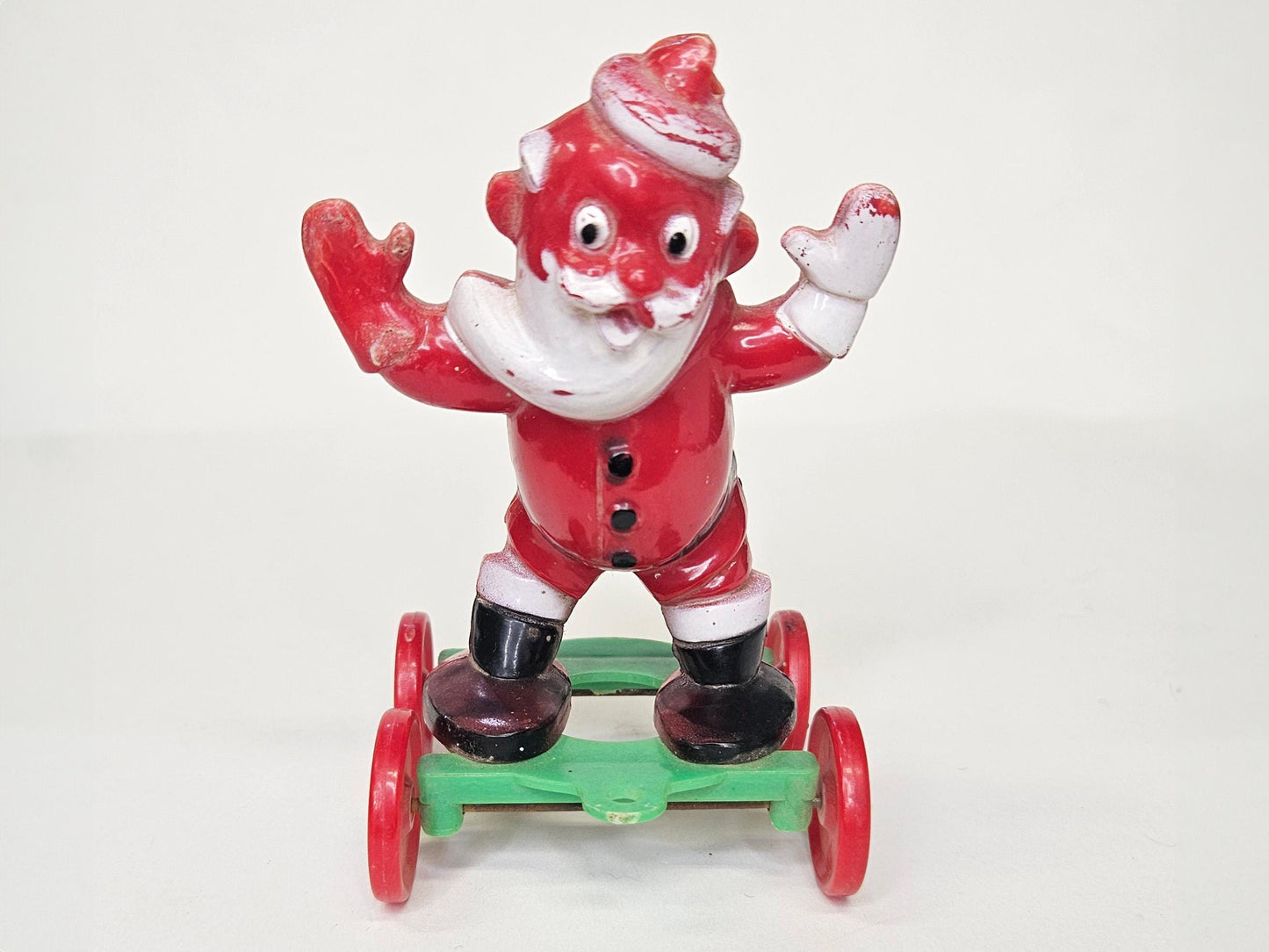 1950's Rosbro - Santa On Wheels Pull Toy and Candy Container - Hard Plastic Santa Candy Container - Missing Christmas stocking on Rt Hand