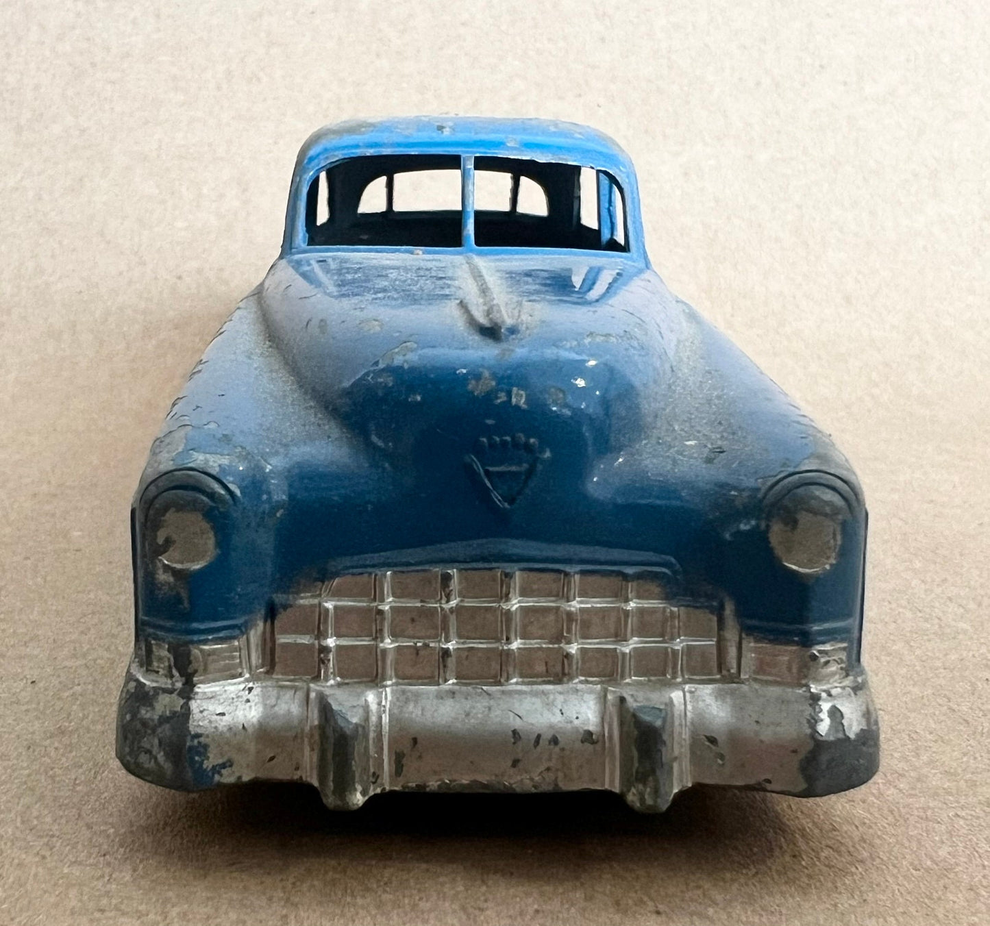 1948 GM Cadillac- Tootsie Toy- 6" long tootsie toy Cadillac - 1:43 Blue Cadillac - All Paint and Tires Original - Played with condition