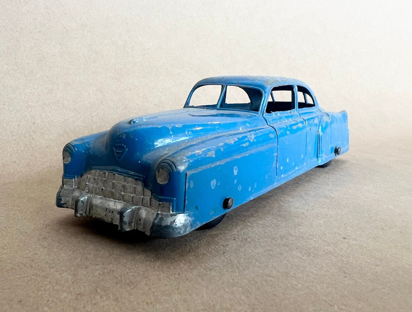 1948 GM Cadillac- Tootsie Toy- 6" long tootsie toy Cadillac - 1:43 Blue Cadillac - All Paint and Tires Original - Played with condition