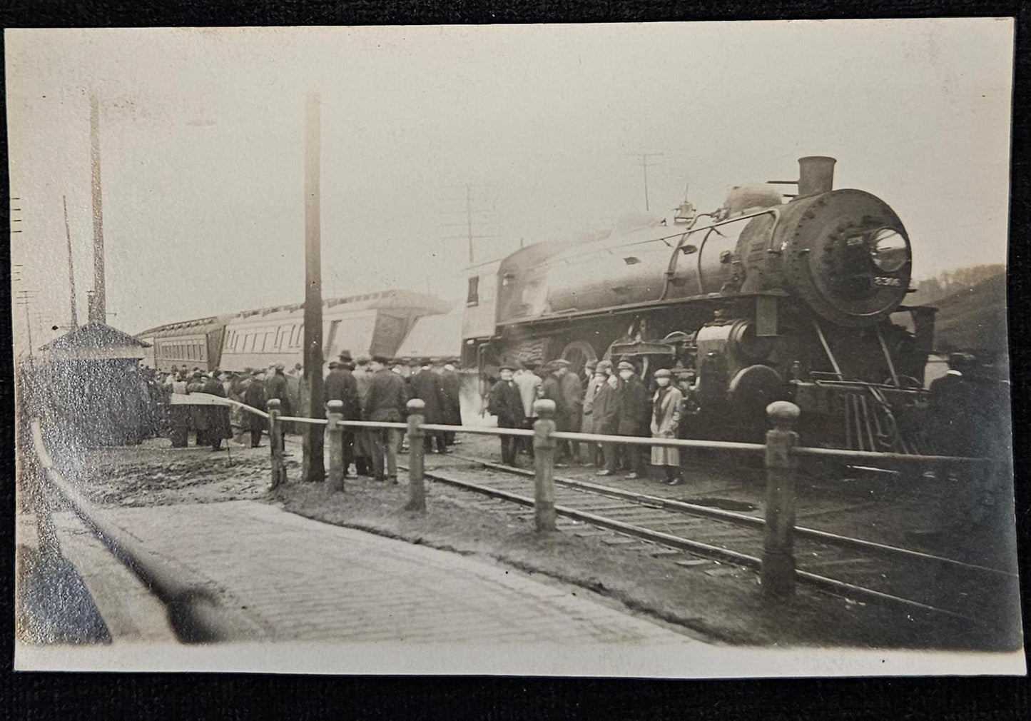 RPPC- Train Wreck with Crowd of Men Observing- 1915 Real Photo Postcard with Train Car Tipped to Side -